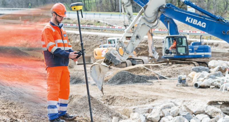 Construction worker on a yellow dozer with Leica iCON machine control system installed